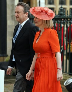 LONDON, ENGLAND - MAY 06: Former prime minister Liz Truss with her husband Hugh O'Leary arrive at the Coronation of King Charles III and Queen Camilla on May 6, 2023 in London, England. The Coronation of Charles III and his wife, Camilla, as King and Queen of the United Kingdom of Great Britain and Northern Ireland, and the other Commonwealth realms takes place at Westminster Abbey today. Charles acceded to the throne on 8 September 2022, upon the death of his mother, Elizabeth II. (Photo by Andrew Milligan - WPA Pool/Getty Images)