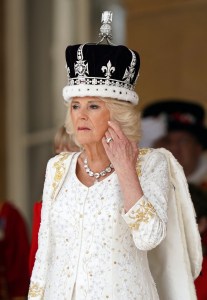 Britain's Queen Camilla receives a royal salute from members of the military in the gardens of Buckingham Place in London, on May 6, 2023, following his coronation. - The set-piece coronation is the first in Britain in 70 years, and only the second in history to be televised. Charles will be the 40th reigning monarch to be crowned at the central London church since King William I in 1066. Outside the UK, he is also king of 14 other Commonwealth countries, including Australia, Canada and New Zealand. Camilla, his second wife, will be crowned queen alongside him, and be known as Queen Camilla after the ceremony. (Photo by Andrew Milligan / POOL / AFP) (Photo by ANDREW MILLIGAN/POOL/AFP via Getty Images)
