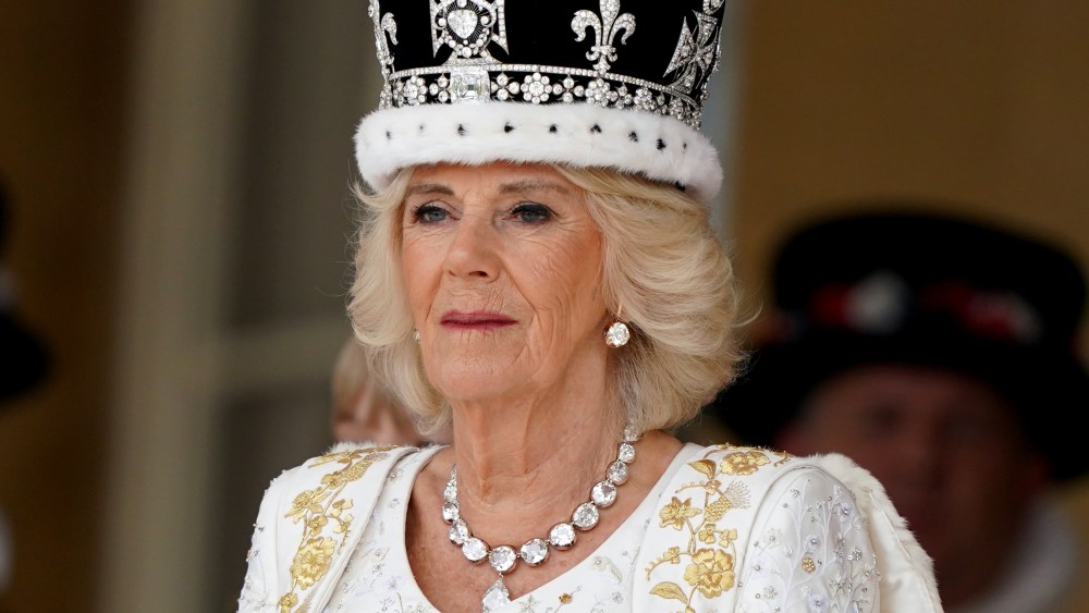 LONDON, ENGLAND - MAY 06: Queen Camilla receives a royal salute from members of the military in the gardens of Buckingham Place, London, following the coronation on May 6, 2023 in London, England. The Coronation of Charles III and his wife, Camilla, as King and Queen of the United Kingdom of Great Britain and Northern Ireland, and the other Commonwealth realms takes place at Westminster Abbey today. Charles acceded to the throne on 8 September 2022, upon the death of his mother, Elizabeth II. (Photo by Andrew Milligan - WPA Pool/Getty Images)