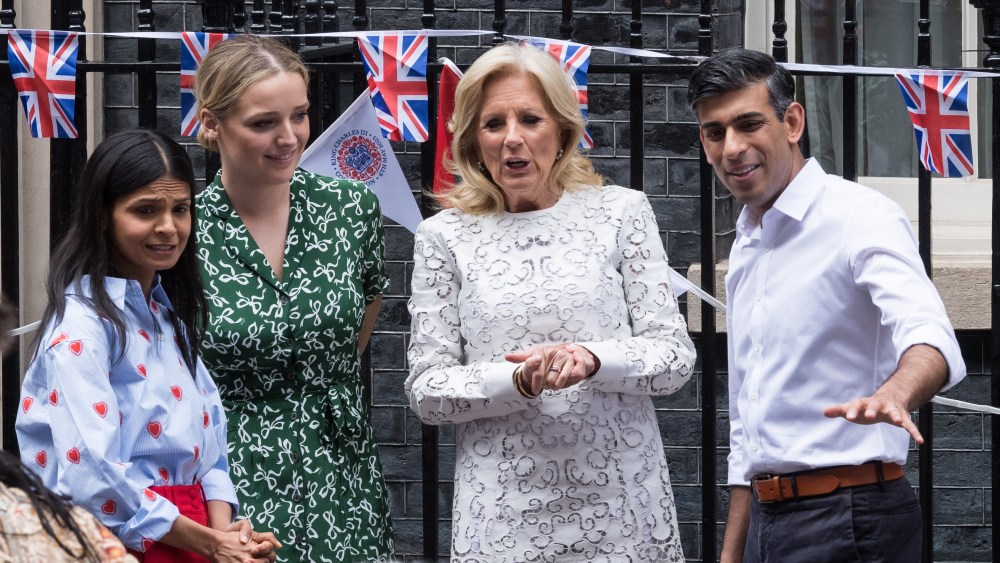 Prime Minister Rishi Sunak (R) and his wife Akshata Murty (L) speak with First Lady of the United States Jill Biden (2R) and granddaughter of US President Joe Biden, Finnegan Biden (2L), as they host a Coronation Big Lunch outside Downing Street in London.
