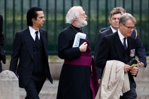 LONDON, ENGLAND - MAY 06: Nick Cave and Rowan Williams arrive at Westminster Abbey ahead of the Coronation of King Charles III and Queen Camilla on May 06, 2023 in London, England. The Coronation of Charles III and his wife, Camilla, as King and Queen of the United Kingdom of Great Britain and Northern Ireland, and the other Commonwealth realms takes place at Westminster Abbey today. Charles acceded to the throne on 8 September 2022, upon the death of his mother, Elizabeth II. (Photo by Jeff J Mitchell/Getty Images)