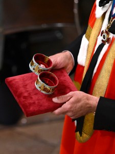 LONDON, ENGLAND - MAY 06: A general view of the two Armills, bracelets made from gold, champlevé and basse-taille enamel, lined in velvet, and are thought to relate to ancient symbols of knighthood and military leadership during the Coronation of King Charles III and Queen Camilla on May 06, 2023 in London, England. The Coronation of Charles III and his wife, Camilla, as King and Queen of the United Kingdom of Great Britain and Northern Ireland, and the other Commonwealth realms takes place at Westminster Abbey today. Charles acceded to the throne on 8 September 2022, upon the death of his mother, Elizabeth II. (Photo by Gareth Cattermole/Getty Images)