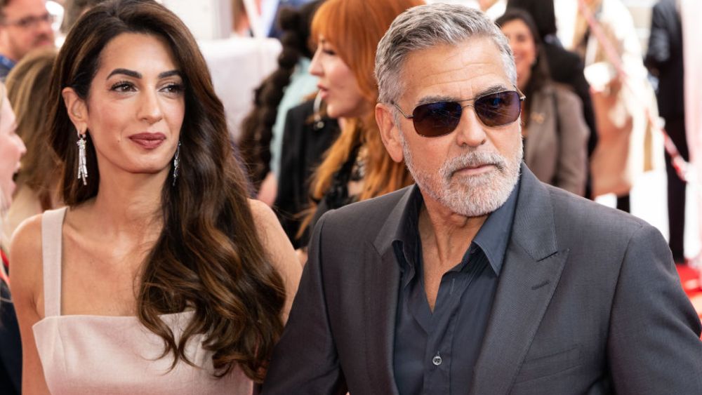Amal Clooney wearing jumpsuit, and George Clooney attend The Prince's Trust and TK Maxx & Homesense Awards 2023 on May 16 in London.
