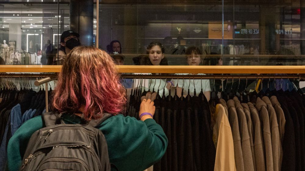 A person go through merchandise at the opening of the Hudson Yards' BTS Pop-Up store as people was in line for a chance to purchase limited items on April 15, 2023 in New York City. The long-awaited BTS POP-UP : SPACE OF BTS in NEW YORK carries a wide variety of official BTS merchandise from stationery and homeware, to apparel and fashion accessories. (Photo by David Dee Delgado/Getty Images)