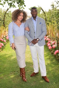 EGHAM, ENGLAND - JUNE 18: Caiya Griffith and Bugzy Malone arrive with a wheely chauffeur to the Cartier Queen's Cup Polo 2023 on June 18, 2023 in Egham, England. (Photo by Dave Benett/Getty Images for Wheely)