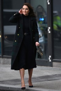 For a visit to the Royal Liverpool University Hospital and the Open Door charity in Birkenhead, Kate rewore a Holland Cooper coat, Cefinn Studio navy rib-knit dress, Gianvito Rossi pumps, and a Mulberry handbag.