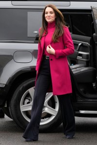 Kate wore an overcoat and turtleneck from Hobbs London and Jigsaw trousers to visit a food bank, with block heels from Emmy London.