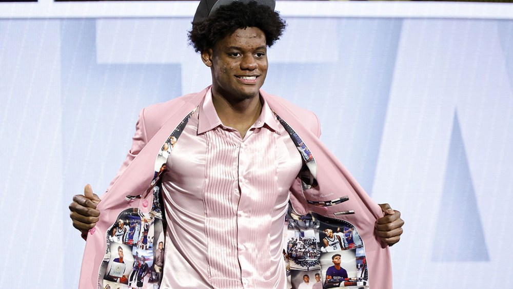 pink suit jacket photos, red carpet look, NEW YORK, NEW YORK - JUNE 22: Taylor Hendricks celebrates after being drafted ninth overall pick by the Utah Jazz during the first round of the 2023 NBA Draft at Barclays Center on June 22, 2023 in the Brooklyn borough of New York City. NOTE TO USER: User expressly acknowledges and agrees that, by downloading and or using this photograph, User is consenting to the terms and conditions of the Getty Images License Agreement. (Photo by Sarah Stier/Getty Images)