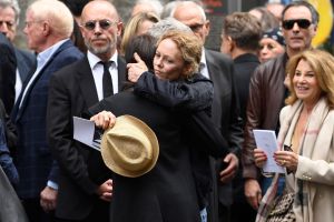 Jane Birkin's daughter and French-British actress Charlotte Gainsbourg (CL) greets French singer Vanessa Paradis (CR) at the end of the funeral ceremony for late British-French singer and actress Jane Birkin at the Saint-Roch church in Paris on July 24, 2023. British-French singer and actress Jane Birkin died at 76, it was announced on July 16, 2023. (Photo by JULIEN DE ROSA / AFP) (Photo by JULIEN DE ROSA/AFP via Getty Images)