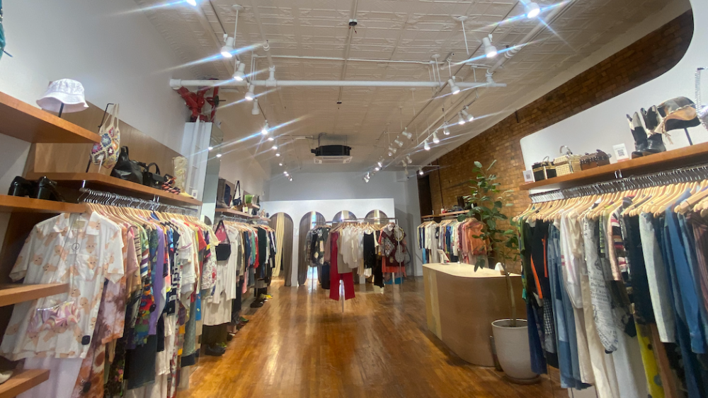 Seven Wonders Collective's Chinatown store features custom wood shelving, archways and a sleek finish.
