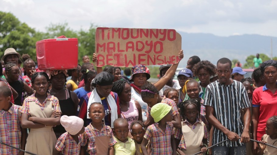 Students march after a press conference to demand the freedom of a New Hampshire nurse and her daughter who were reported kidnapped. Port-au-Prince, Haiti.