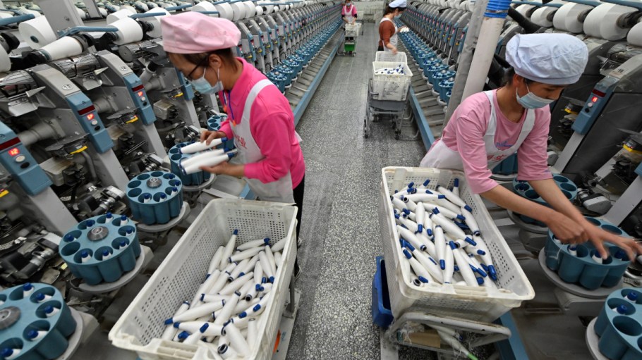 Employees work at a textile factory on April 1, 2021 in Korla, Xinjiang Uyghur Autonomous Region of China.