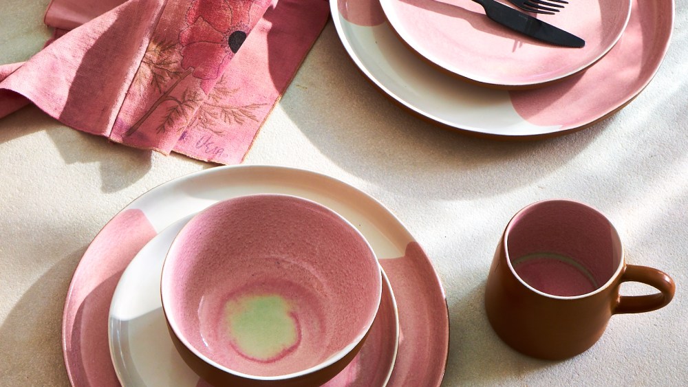 Rentrayage is moving further into home, with linens and ceramics. Seen here are a burst of berry-toned plates, cups and bowls.