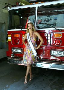 NEW YORK - APRIL 16:  Newly crowned Miss USA 2004 Shandi Finnessey poses for a photo in FDNY's engine 39 and ladder 16 firehouse on Manhattan's Upper East Side April 16, 2004 in New York City. (Photo by Paul Hawthorne/Getty Images)