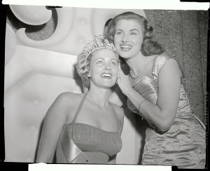 (Original Caption) Christianne Martel, last year's Miss Universe, crowns this year's winner, blonde Miriam Stevenson. A South Carolina coed, Miss Stevenson was elected Miss united States prior to the July 23rd judging of the Miss Universe contest.