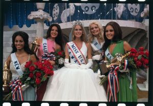 5/20/1972- San Juan, Puerto Rico: Tanya Wilson, Miss U.S.A., of Honolulu, wears crown and is surrounded by runners-up in the pageant.