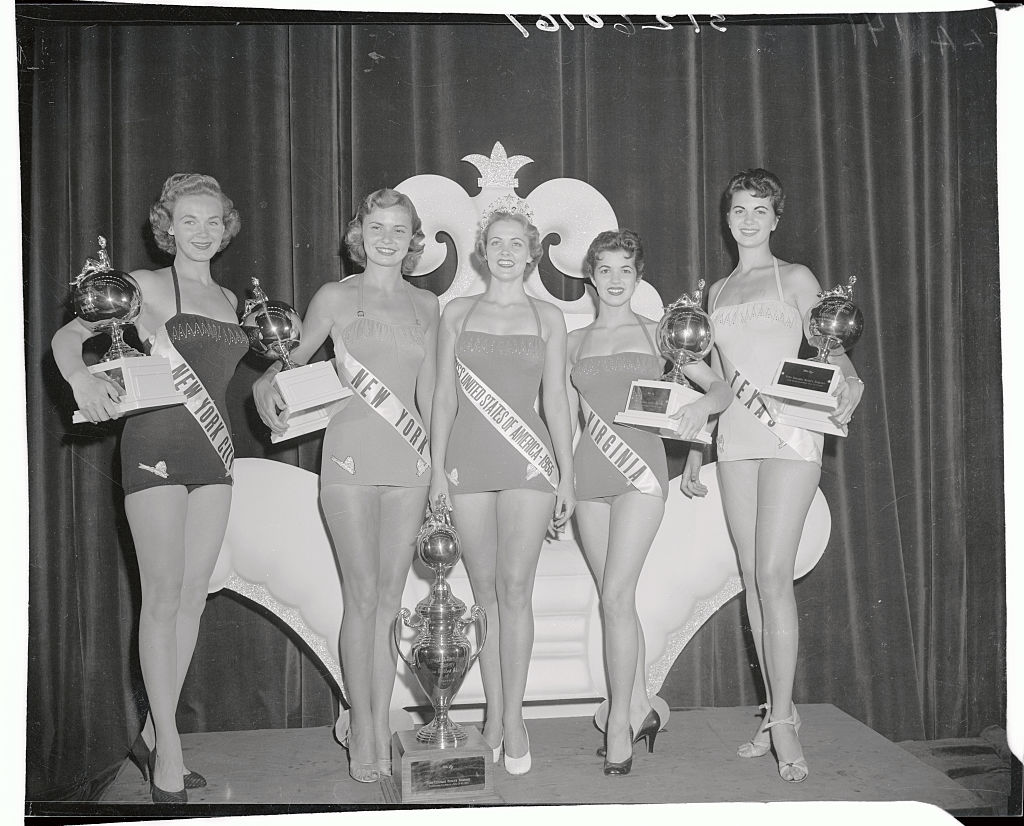 (Original Caption) Proudly showing their trophies are the winners in Wednesday night's judging of the "Miss U.S.A." division of the "Miss Universe" contest. Left to right: Miss New York City, Rene Roy, Fourth Place; Miss New York, Karen Huitman, third place; Miss South Carolina, Mirian Stevenson, "Miss U.S.A."; Miss Virginia, Ellen Whitehead, second place; and Miss Texas, Betty Lee, fifth place. The South Carolina belle last night won the "Miss Universe" crown to win the third annual beauty pageant at Long Beach.