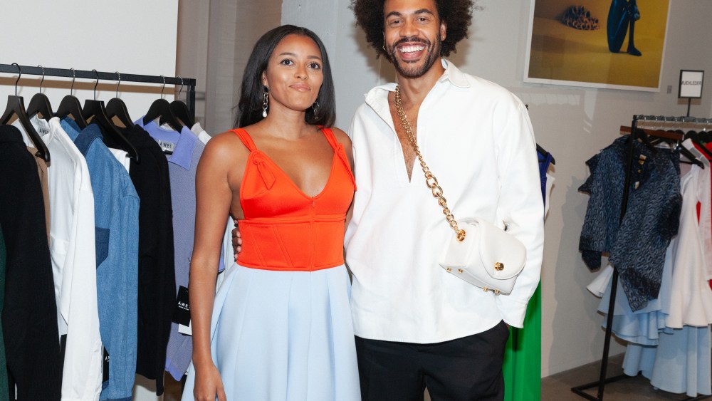 At the Livewear opening, Larissa Muehleder and Charles Harbison pose for a photo beaming.