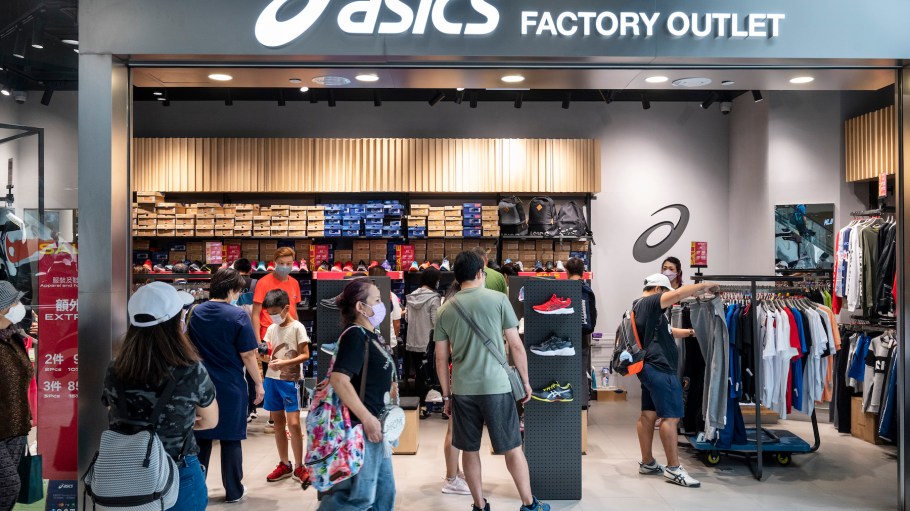 Shoppers are seen at the Japanese multinational sports equipment brand Asics outlet store in Hong Kong.