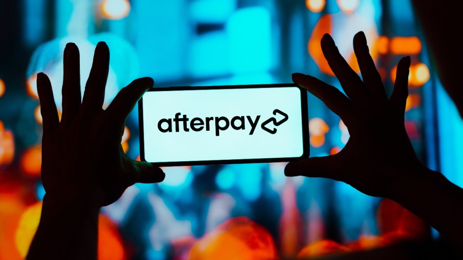 The Afterpay logo is displayed on a smartphone screen.