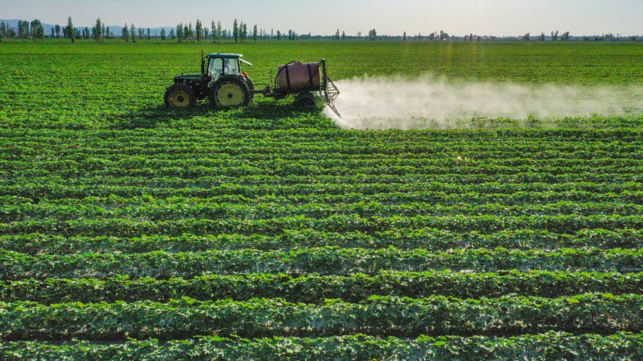 CHANGJI, CHINA - JUNE 17: A farmer drives agricultural machine to spray agrichemicals in a cotton field on June 17, 2023 in Hutubi County, Changji Hui Autonomous Prefecture, Xinjiang Uygur Autonomous Region of China.