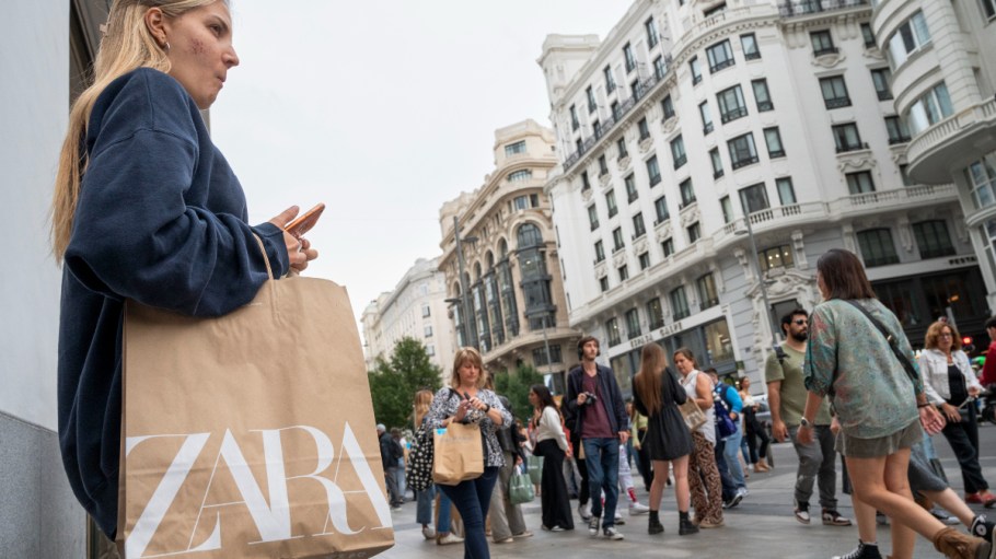 A shopper carries a shopping bag from the Spanish multinational clothing brand, owned by Inditex, Zara in Spain.