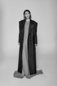 Sacai wool, cupro and nylon dress; Jacob Lee wool coat; Pamela Love necklace.
