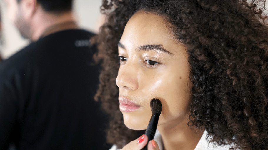 Woman applying skin tint