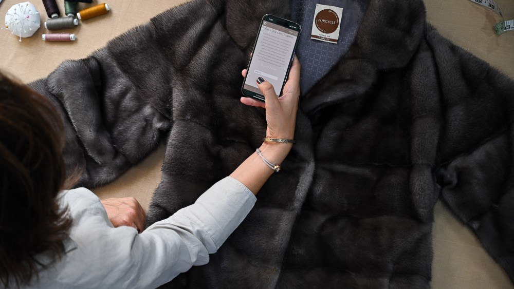 The vintage and pre-loved lable Furcycle issued by the International Fur Federation seen on a fur coat.