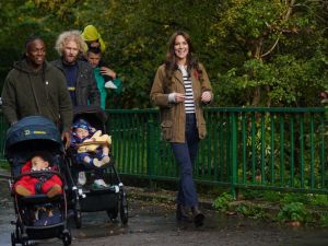LONDON, ENGLAND - NOVEMBER 1: Catherine, Princess of Wales takes part in a Dad Walk in the local park during a visit to "Dadvengers", a community for dads and their children, in Arnos Grove, north London, to highlight the important role that Dads play in their children's earliest years, as part of her Shaping Us campaign on early childhood, on November 1, 2023 in London, England. Dadvengers is predominately an online community which works to support dads on their journey through parenthood. It has a strong focus on mental wellbeing and supports new fathers in a variety of ways including through online training programmes, podcasts, and more recently the in-person Dad Walks. (Photo by Yui Mok - WPA Pool/Getty Images)