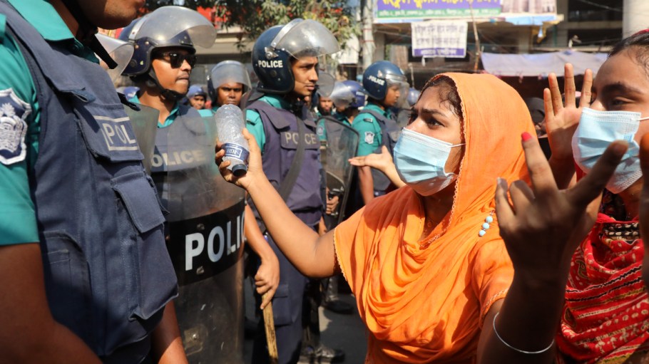 Police try to convince garment industry workers to leave the streets, as they continue to protest on the street demanding a wage raise, at Mirpur area of Dhaka, Bangladesh on Nov. 12, 2023.