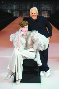 Giorgio Armani with a model wearing a look from the fall Giorgio Armani Prive collection.