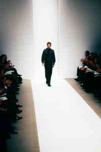Calvin Klein walks the runway in 1996