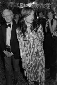 Andy Warhol (L) and Diane von Furstenberg (C) attend a party in New York City on January 13, 1977. (Photo by Abner Symons/WWD/Penske Media via Getty Images)