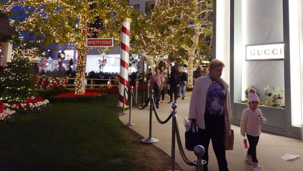 GLENDALE, CALIFORNIA - DECEMBER 26: People walk past a Gucci store in the Americana at Brand shopping center on the day after Christmas on December 26, 2023 in Glendale, California. U.S. retail sales rose 3.1 percent year over year this holiday season, based on in-store and online purchases, according to Mastercard SpendingPulse. (Photo by Mario Tama/Getty Images)