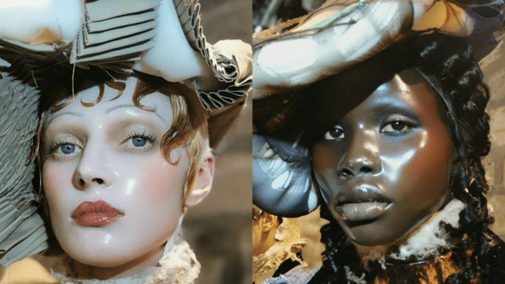 two models at Maison Margiela's Couture 2024 show with glass skin makeup looks by Pat McGrath