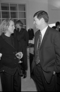 Fashion designer Jil Sander talking to a man at the opening of her store in Los Angeles