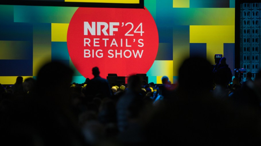 NRF 2024 conference attendees prepare for a keynote session.