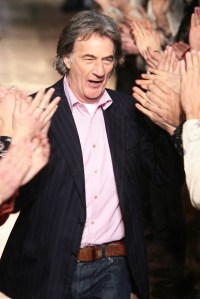 Designer Paul Smith on the runway after his fall 2006 menswear show at the Ecole Nationale Superieure des Beaux-Arts.