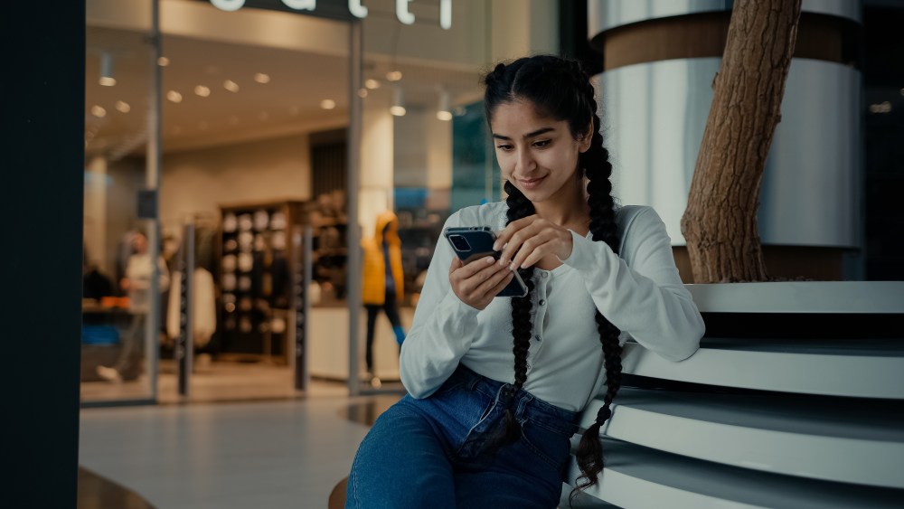 Female student middle-eastern girl businesswoman arabian ethnic woman student shopper chatting on phone sit at shopping center use mobile apps purchasing online read digital news watch internet video. High quality 4k footage