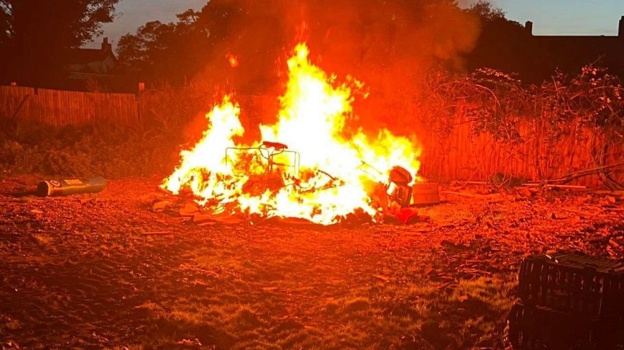 Sheep's wool fleeces burn on a farm in England.
