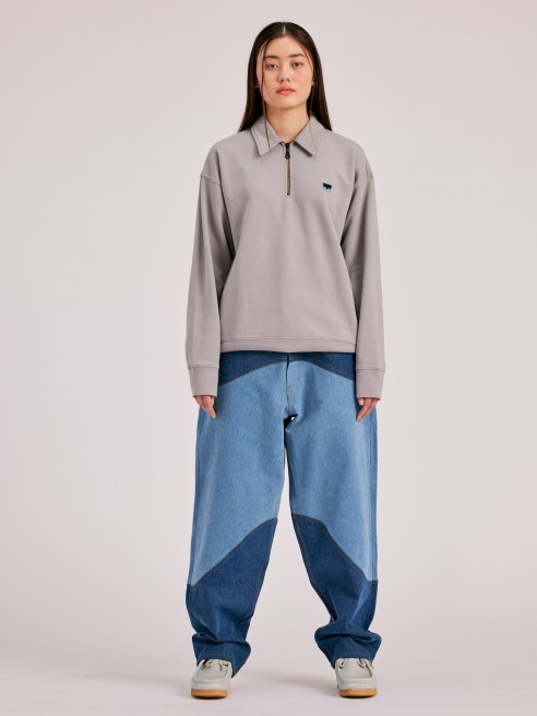 Fashion's shift to denim and looser fits could impact athletic apparel retailers such as Lululemon, Jefferies analyst Randal J. Konik said.