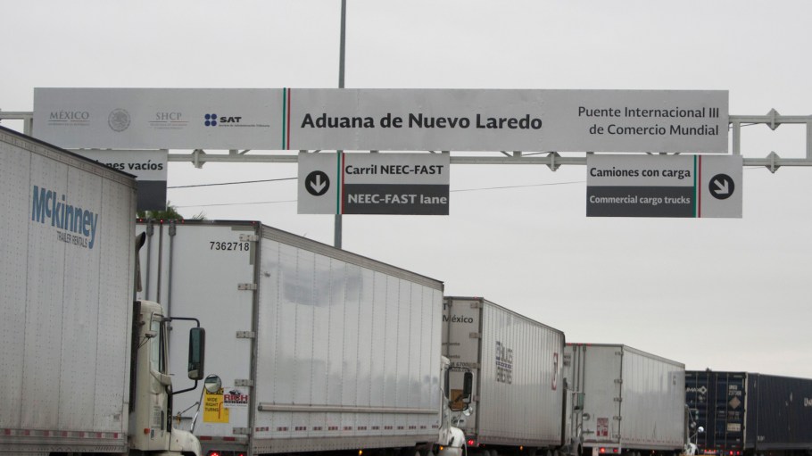 Commercial cargo trucks cross the World Trade International Bridge in Nuevo Laredo, Mexico, into Laredo, Texas.