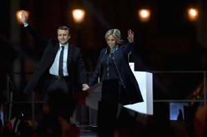 Leader of 'En Marche !' Emmanuel Macron and his wife Brigitte wave to supporters after winning the French Presidential Election, at The Louvre on May 7, 2017 in Paris, France.