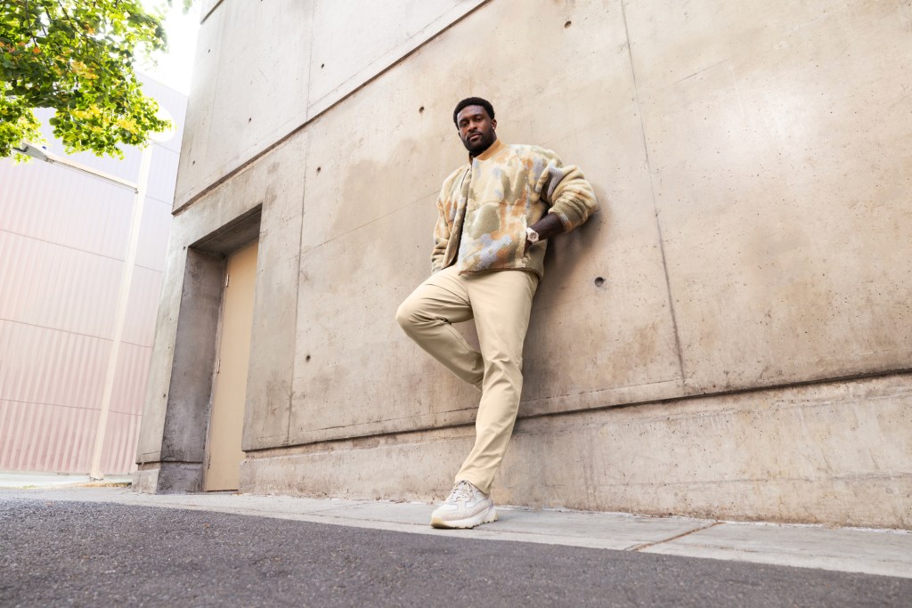 DK Metcalf in Lululemon leaning on wall
