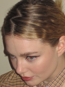 A look at Kristine Froseth getting ready for the Miu Miu Fall 2024 show.