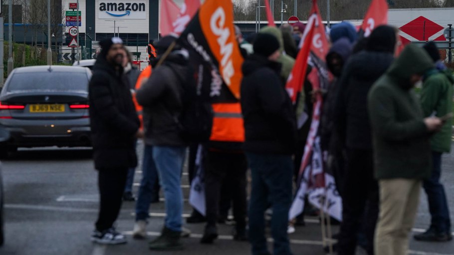 Amazon staff members on a GMB union picket line outside the online retailer's site in Coventry, as they take part in a strike in their long-running dispute over pay.