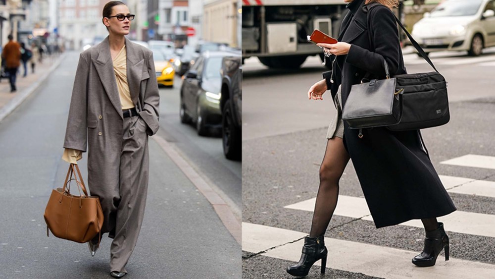 two woman carrying laptop bags in business attire on city streets