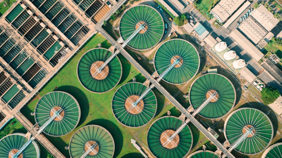 Wastewater treatment plants in a large green field.