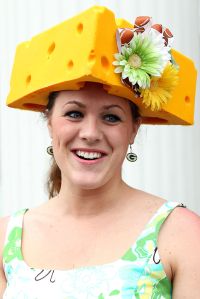 LOUISVILLE, KY - MAY 07:  A fan wears a cheese head hat in the paddock area during the 137th Kentucky Derby at Churchill Downs on May 7, 2011 in Louisville, Kentucky.  (Photo by Jamie Squire/Getty Images)